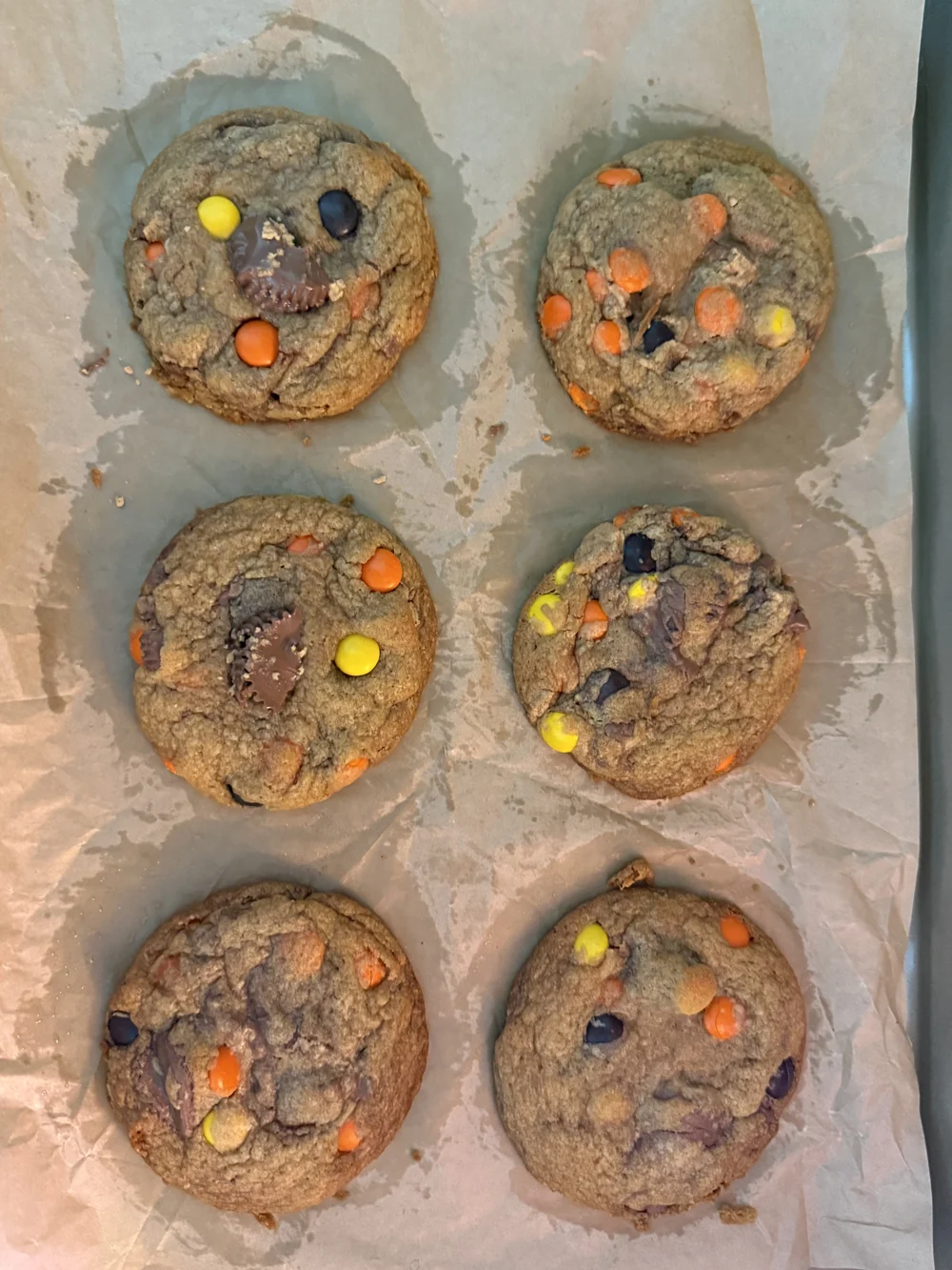 Candy-studded cookies on parchment